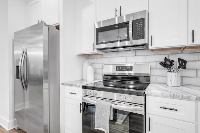 kitchen featuring appliances with stainless steel finishes and white cabinetry