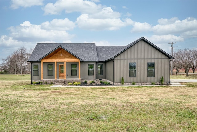 view of front facade with covered porch and a front lawn