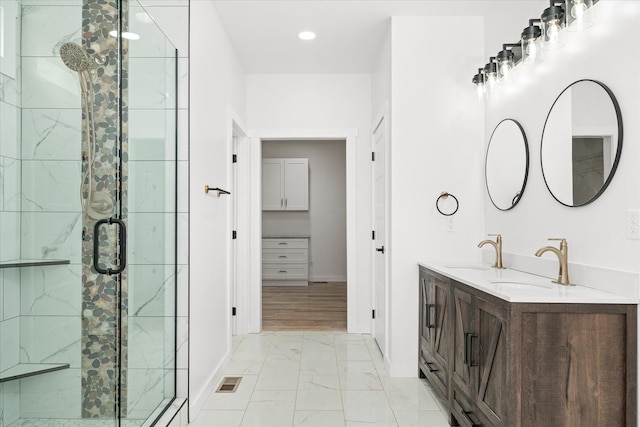 bathroom with vanity and an enclosed shower