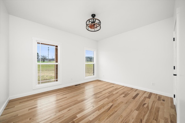 unfurnished room featuring light hardwood / wood-style flooring