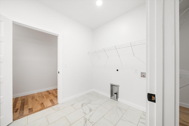 laundry room featuring electric dryer hookup and washer hookup