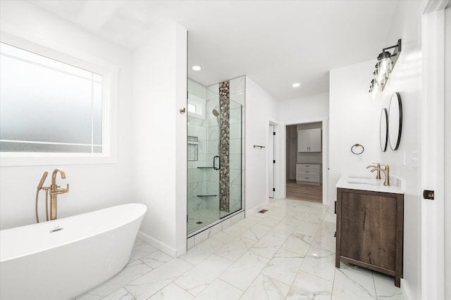 bathroom with vanity and independent shower and bath