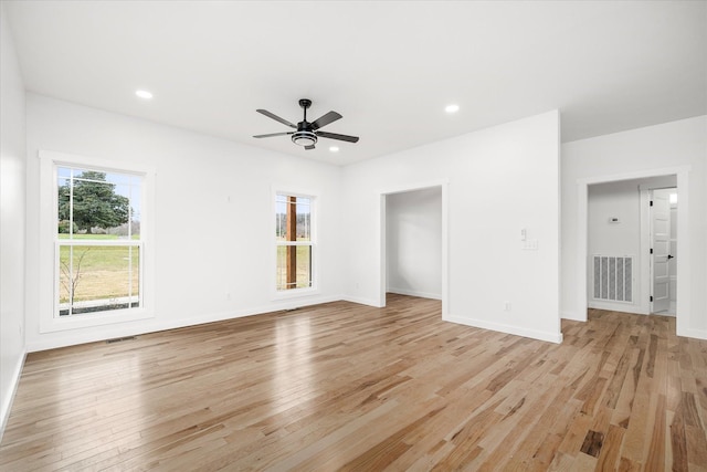 unfurnished living room featuring ceiling fan and light wood-type flooring