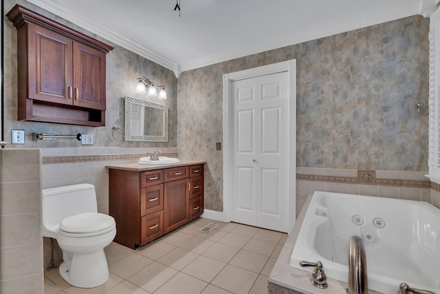 bathroom with tile patterned floors, ornamental molding, vanity, tiled bath, and toilet