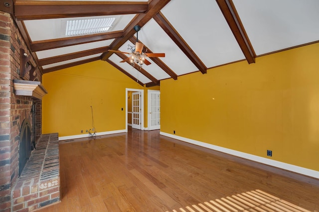 unfurnished living room with ceiling fan, beamed ceiling, high vaulted ceiling, and hardwood / wood-style flooring