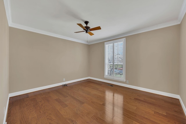 unfurnished room with ceiling fan, hardwood / wood-style floors, and ornamental molding