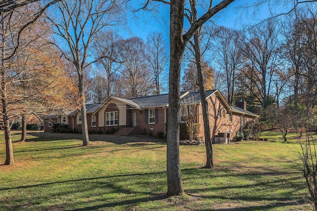 view of property exterior with a yard