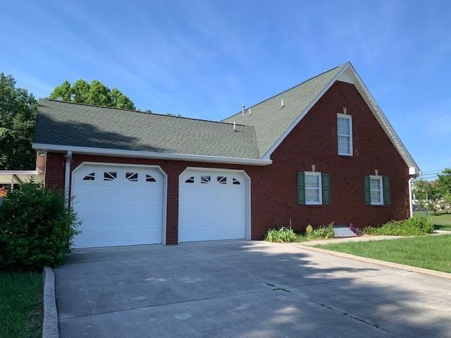view of side of property with a garage
