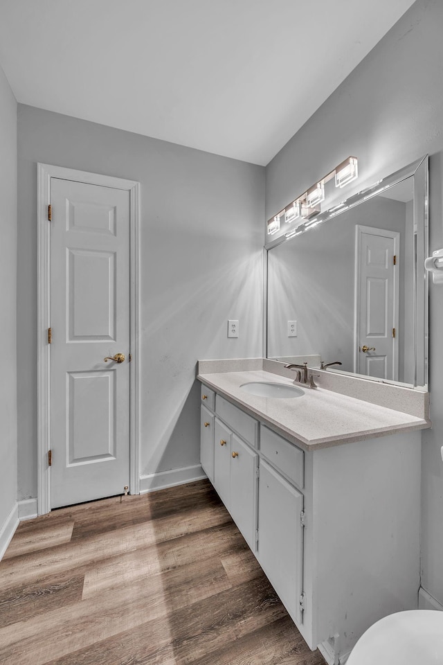 bathroom featuring vanity and hardwood / wood-style flooring