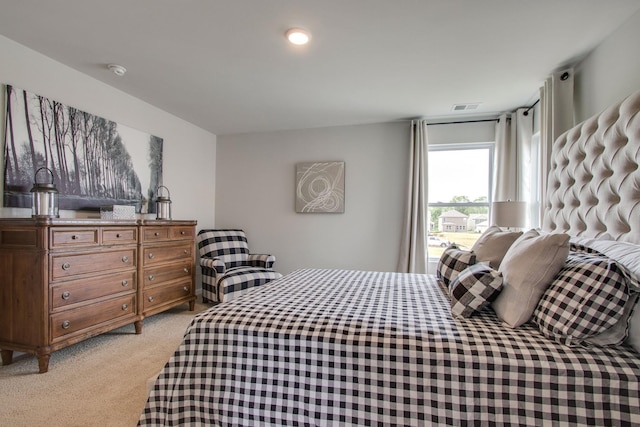 bedroom with light colored carpet