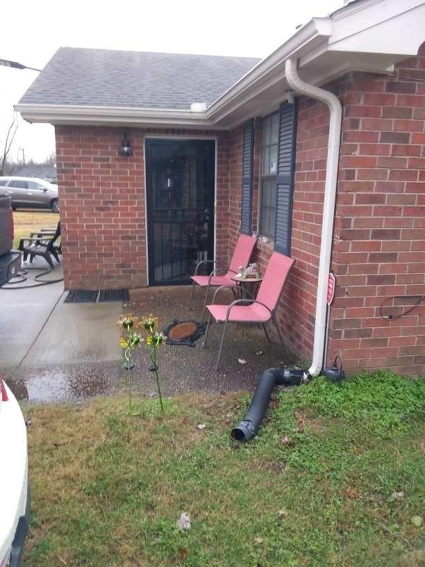 exterior space with a lawn and a patio area