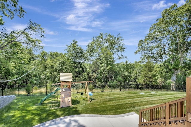 view of jungle gym featuring a lawn