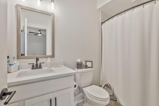 bathroom with walk in shower, vanity, toilet, and ceiling fan