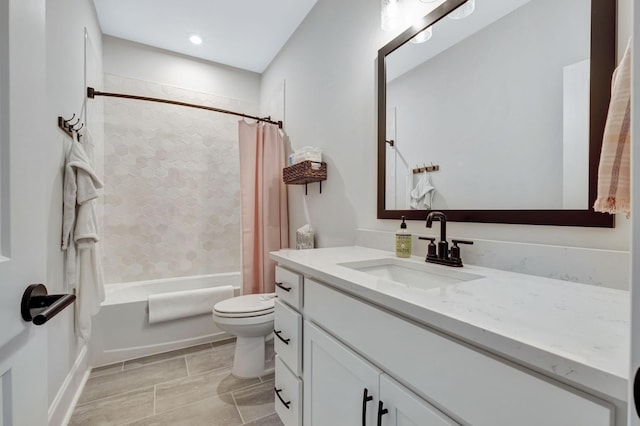 full bathroom with shower / tub combo with curtain, vanity, and toilet