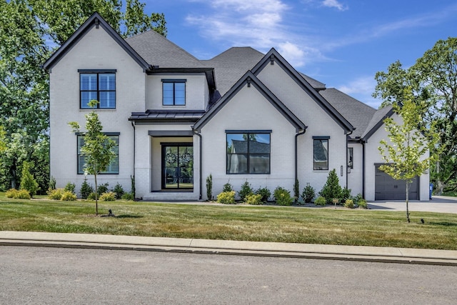 french country home featuring a front lawn