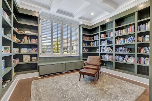 sitting room featuring beamed ceiling, wood-type flooring, radiator, and coffered ceiling