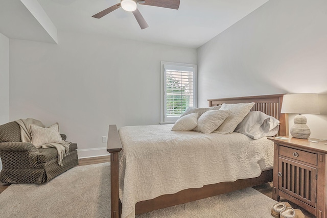 bedroom with hardwood / wood-style floors and ceiling fan