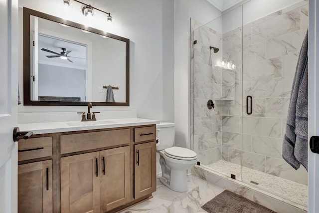 bathroom featuring ceiling fan, crown molding, an enclosed shower, toilet, and vanity