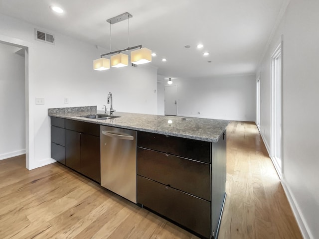 kitchen featuring stainless steel dishwasher, dark brown cabinetry, sink, pendant lighting, and light hardwood / wood-style flooring