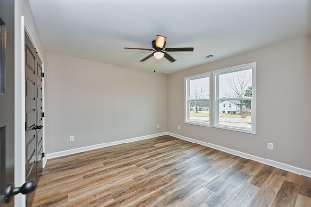 unfurnished room featuring ceiling fan and light wood-type flooring