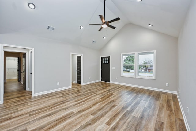 interior space with light wood-type flooring, high vaulted ceiling, and ceiling fan