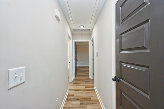 hall with light wood-type flooring