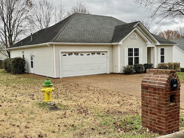 view of side of property featuring a garage