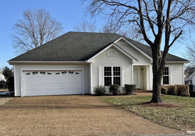 ranch-style house featuring a front lawn and a garage