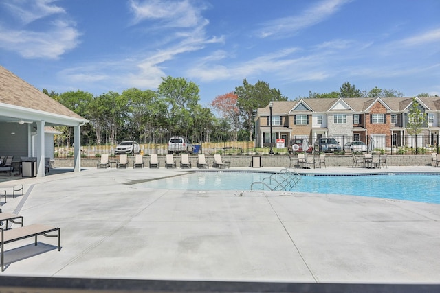 view of swimming pool with a patio