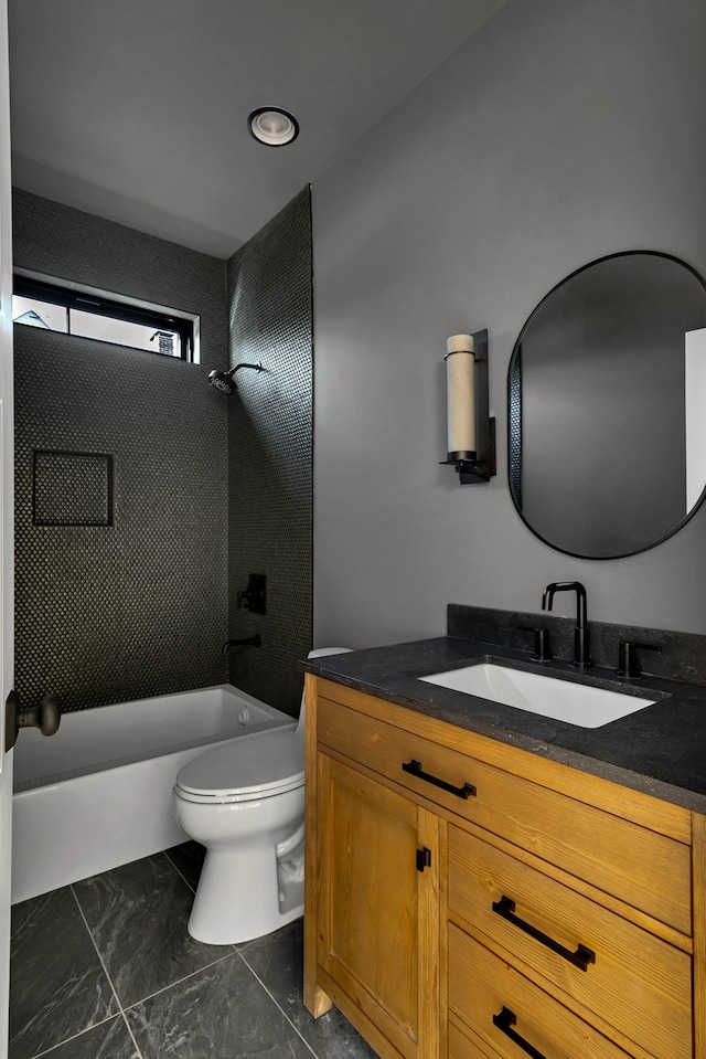 full bathroom featuring toilet, vanity, and shower / washtub combination