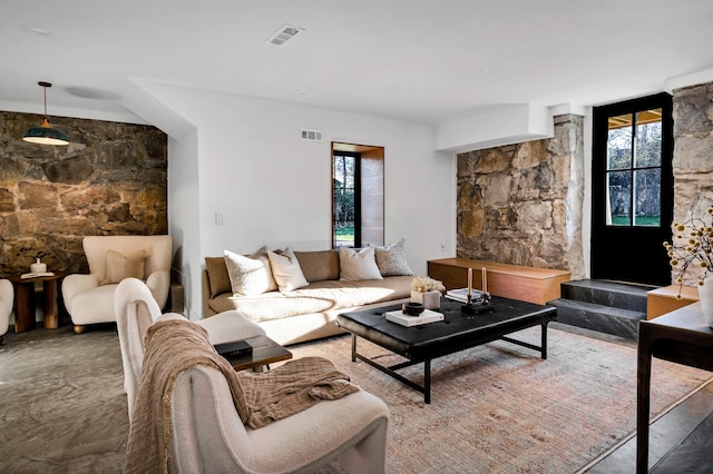 living room featuring visible vents