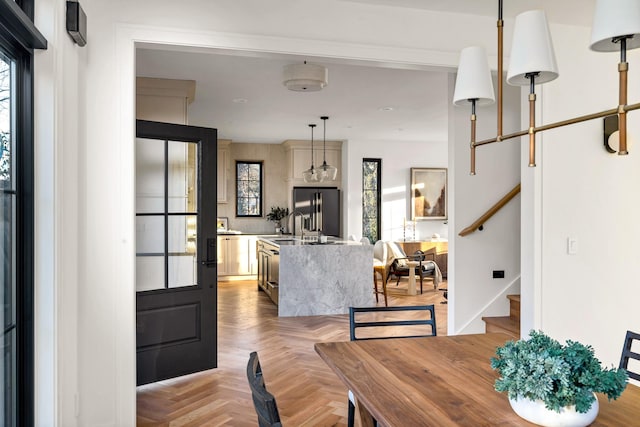 dining area featuring light parquet floors