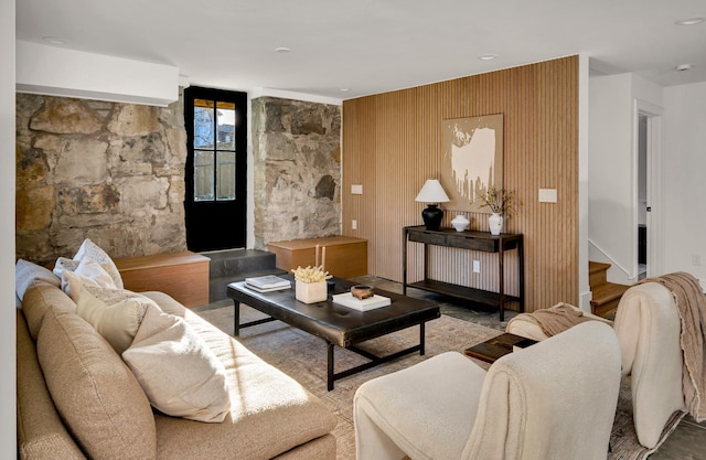 living room with wood walls