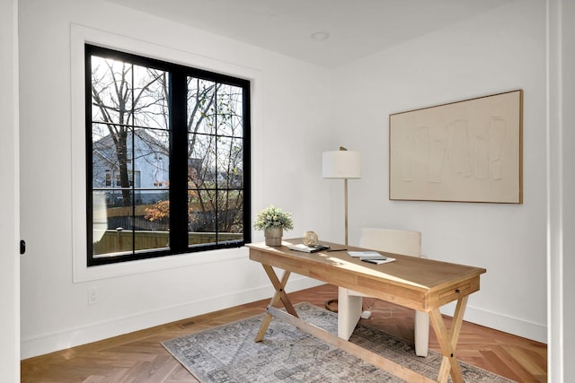 office featuring parquet flooring