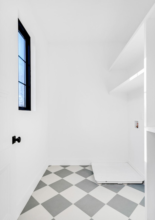 interior space featuring baseboards and tile patterned floors