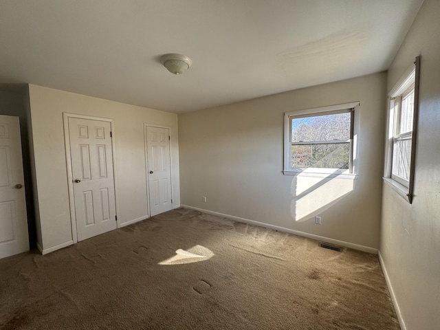 unfurnished bedroom with carpet flooring