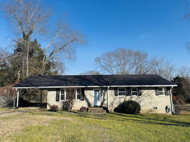 ranch-style home with a front yard and a carport