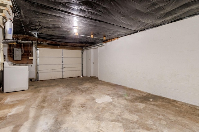 garage featuring electric panel and washer / clothes dryer