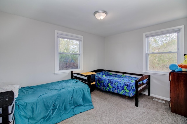 bedroom with light colored carpet