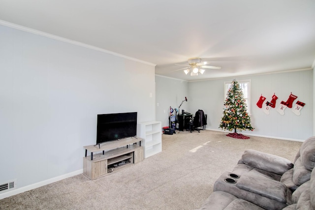 living room featuring ceiling fan, carpet floors, and crown molding