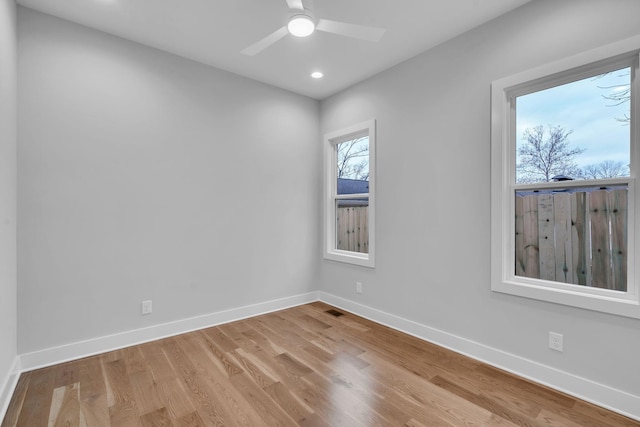 empty room featuring light wood-type flooring and ceiling fan