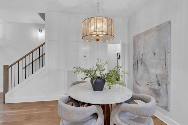 dining space featuring hardwood / wood-style flooring