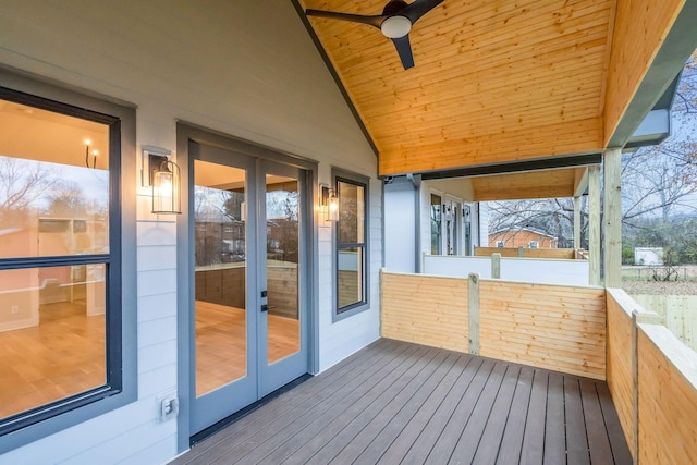 unfurnished sunroom featuring ceiling fan, wooden ceiling, and vaulted ceiling