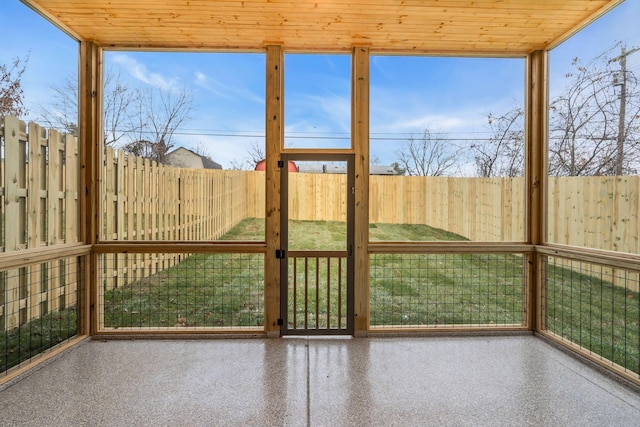 unfurnished sunroom with wooden ceiling