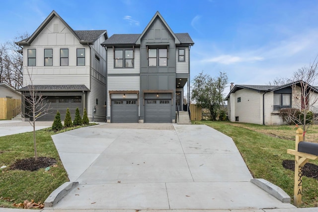 view of front of home featuring a garage and a front yard