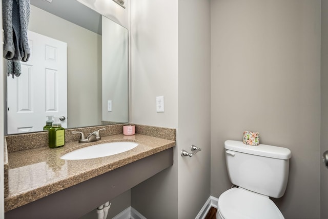 bathroom featuring toilet and sink