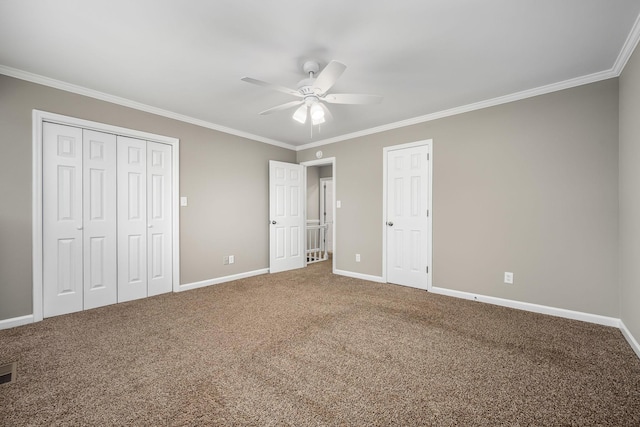 unfurnished bedroom featuring carpet flooring, ceiling fan, and ornamental molding