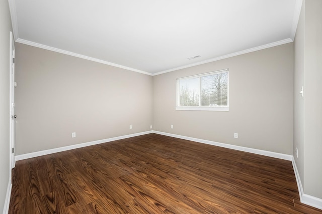 empty room with crown molding and dark wood-type flooring