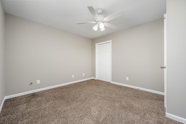 empty room with carpet floors and ceiling fan