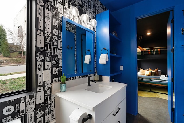 bathroom featuring concrete flooring and vanity